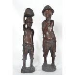 A pair of African tribal figurines havin