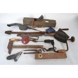 A collection of vintage tools and irons