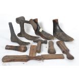 A collection of vintage wooden shoe stop