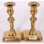 A pair of 19th century brass pusher cand