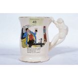 An early to mid century comic cider mug,