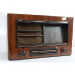 A vintage valve radio in oak case by KB.