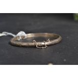A ladies silver bracelet of simple form