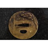 A Japanese brass and gold inlaid tsuba h