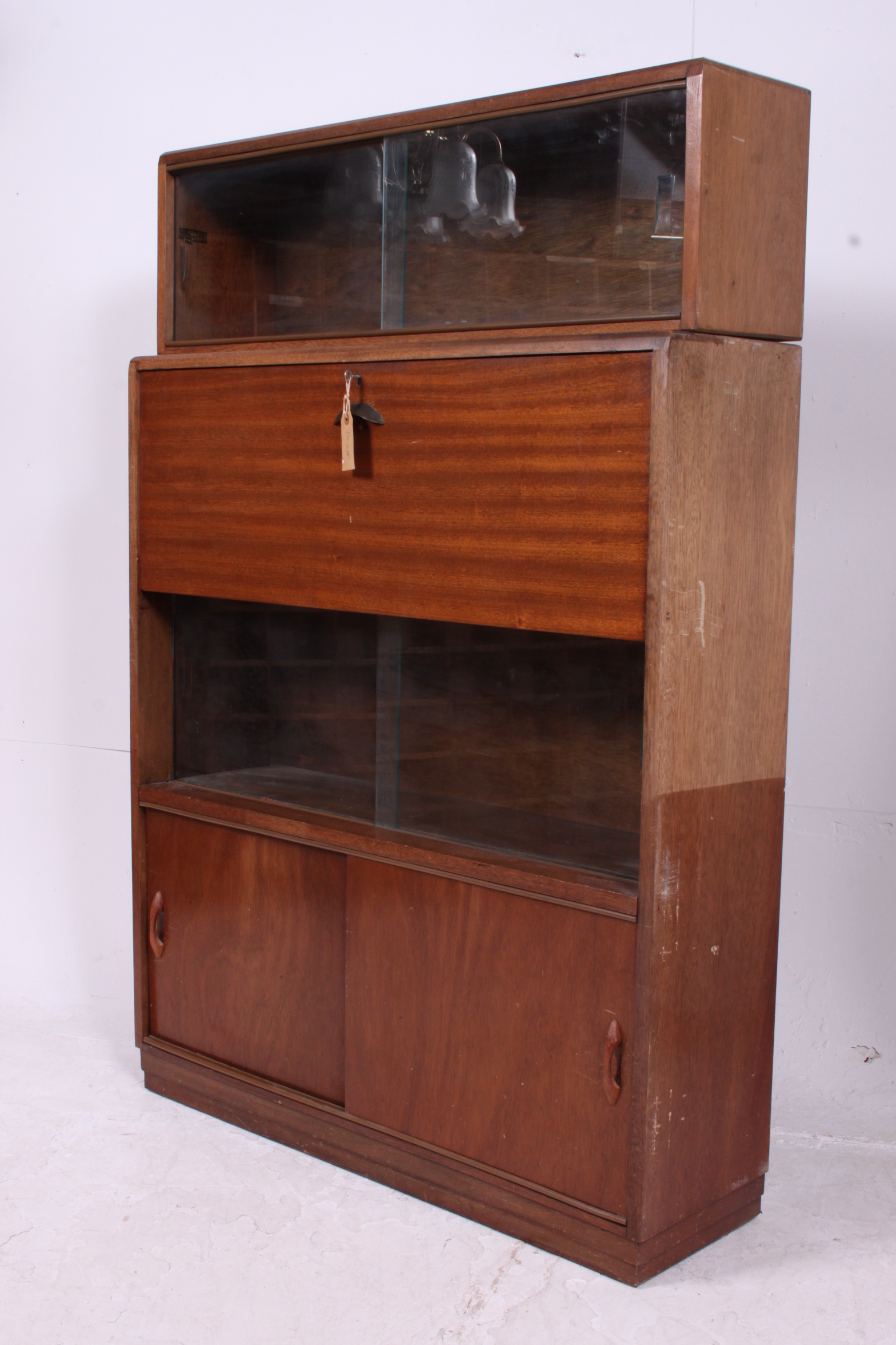 A mid 20th century lawyers mahogany stacking bookcase cabinet having sectional body with cupboards