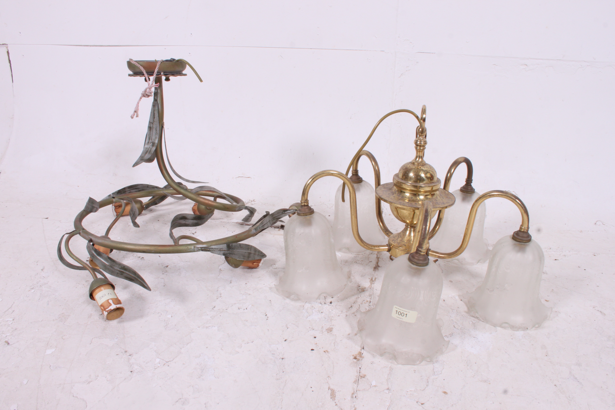 A 20th century toleware style chandelier having foliate design together with a brass chandelier