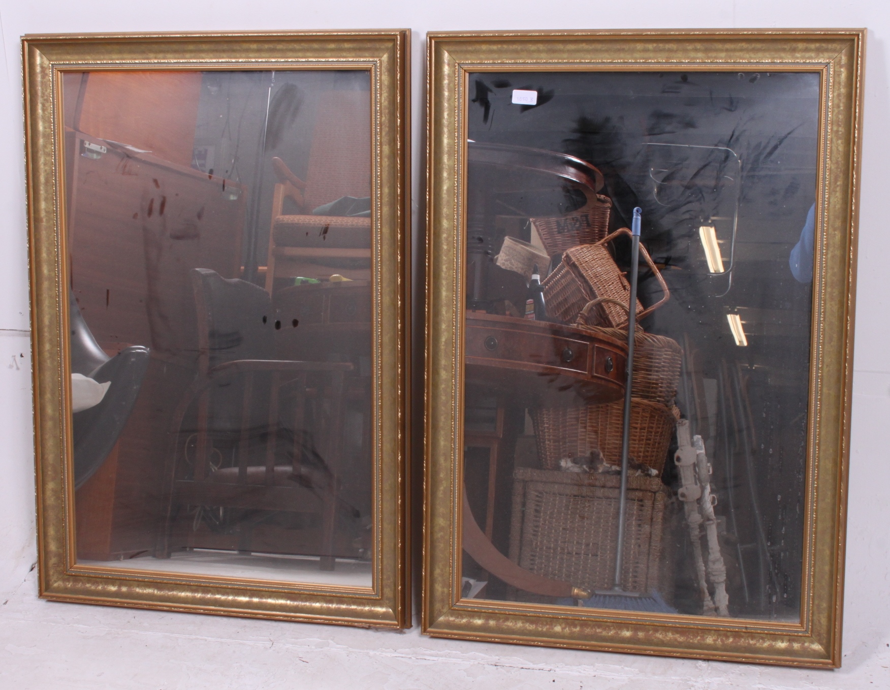 A collection of 2 matching gilt mirrors dating to the 20th century ( see illustration ).