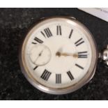 A silver hallmarked pocket watch having enamel face with subsiduary seconds dial by M Cohen & Co of