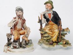 Two 20th century artist signed Capo Di Monte tramp figurines in ceramic.