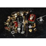 A collection of costume jewellery to include brooches etc along with a collection of vintage 20th