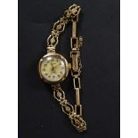 A vintage ladies 9ct gold Roamer cocktail watch, with 9ct gold bracelet.  Weight 13.