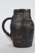 A Victorian Doulton & Slater`s Patent Stoneware Jug modelled as a leather bombard with stitched
