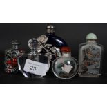 A collection of 5x Chinese snuff bottles, two being glass, one armorial, one being a perfume bottle.