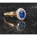 An 18ct gold sapphire and diamond ladies ring. Measures: 3.6g size P.