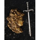 A white metal marked ' silver ' sword brooch,