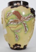 A 19th century majolica glazed vase of bulbous form with embellished decoration. Unmarked. 19.