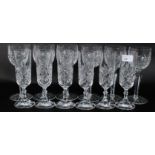 A set of six matching cut lead crystal wine glasses along with six matching champagne glasses.