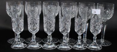 A set of six matching cut lead crystal wine glasses along with six matching champagne glasses.