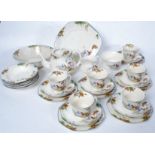 A good 20th century Midwinter tea service comprising teapot, cups, saucers, tea plates,
