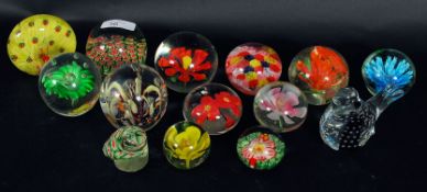 A collection of glass paperweight - mostly 20th century to include coloured etc.