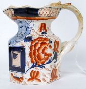 A 19th century Ironstone Imari pattern jug having dragon embellished handle with handpainted Imari