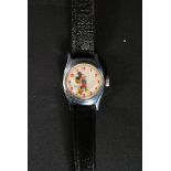 A vintage / retro Micky Mouse wrist watch with Micky to face and his arms and gloves acting as