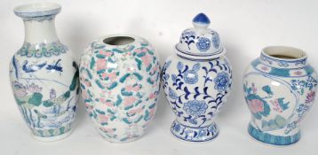 Four large floor standing Chinese vases of different designs.