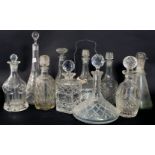 A collection of ten ( 10 ) assorted decanters to include ships, crystal,