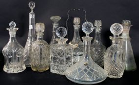 A collection of ten ( 10 ) assorted decanters to include ships, crystal,