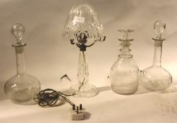 A collection of glassware to include a pair of mid-century glass drinks decanters,