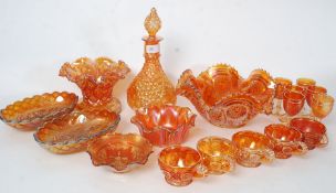 A large collection of 20th century coloured carnival glass to include cups, plates,