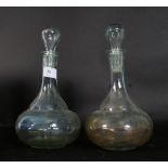 A pair of early 20th century hand blown decanters.