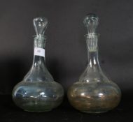 A pair of early 20th century hand blown decanters.