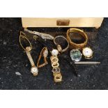 A collection of vintage ladies cocktail watches along with gents and a silver metal propelling