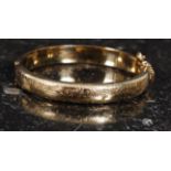 A good quality 20th century decorative ladies rolled gold bangle , weight 15.