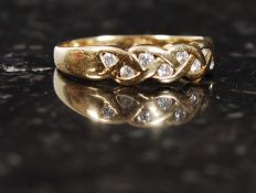 An 18ct gold wedding band, with 16 inset