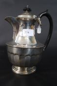 A silver hallmarked coffee pot of large