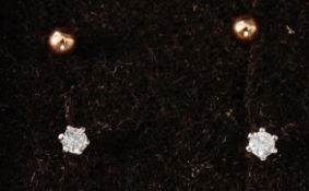 A pair of 9ct diamond claw set stud earr