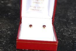 A 9ct gold ladies pair of round faceted