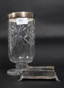 A silver hallmarked rimmed cut glass vas