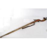 A 20th century large Jezail rifle of decorative form having brass mounts etc