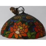 A large 20th century coloured glass Tiffany shade of circular form having decorative design.