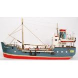 A vintage scratch built model of a ship being hand painted.