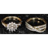 Two 9ct yellow gold and diamond ladies rings.