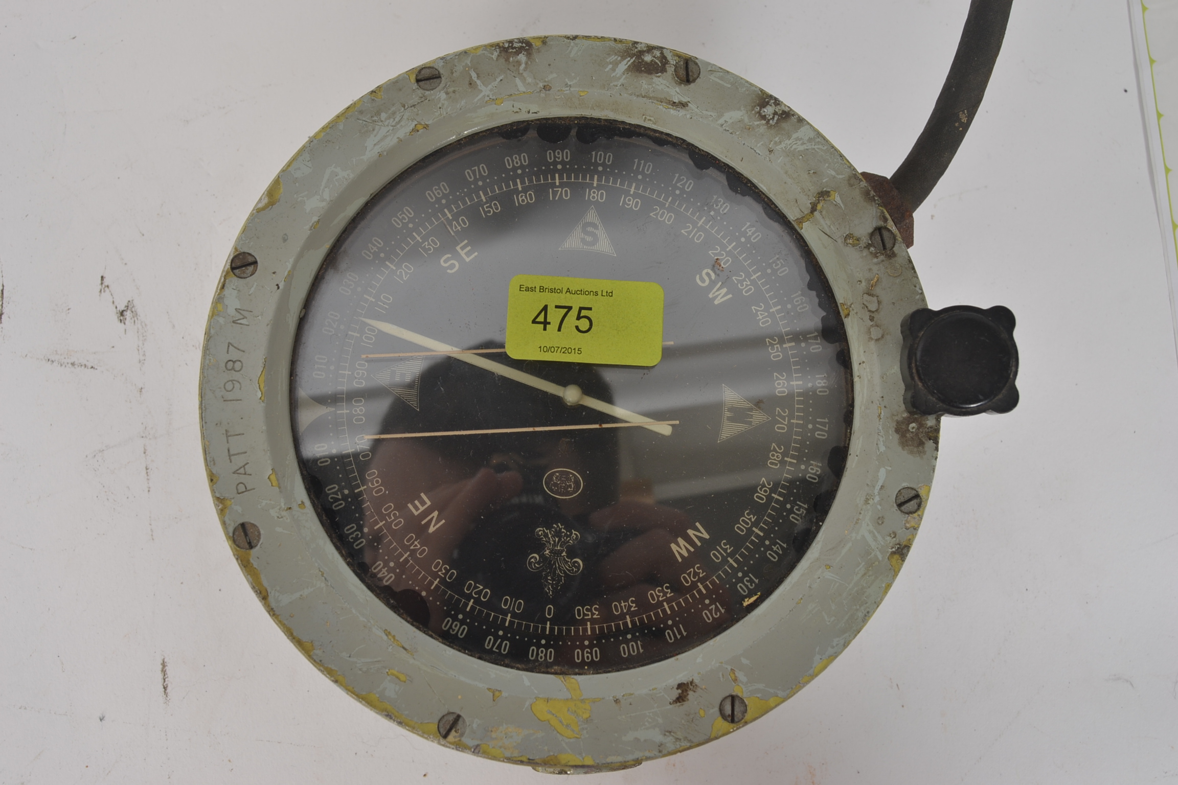 A vintage 20th century Military ? Naval compass having covered dial in military grey.