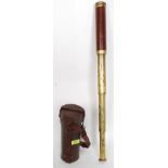 A 19th century leather cased 3 draw brass telescope having a retailers label to the inside of the