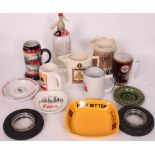 A collection of breweriana / pub advertising to include ashtray, jugs, Syphon and other items.