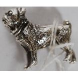 A 20th century white metal (stamped ' 925 ' for silver ) dog charm