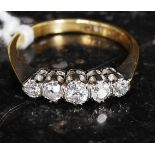 An 18ct gold and platinum diamond ring, 5 stones. Approx 50pts.