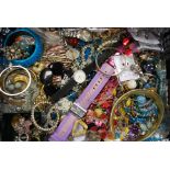 A collection of assorted costume jewellery to include watches, bracelets, brooches and other items.